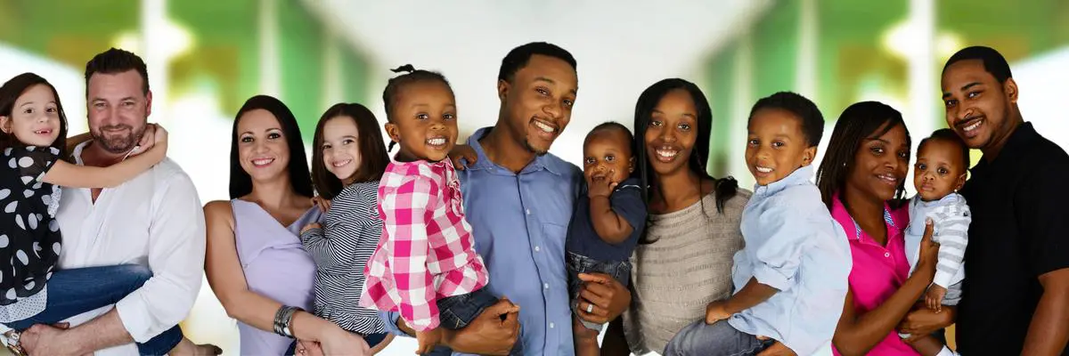 A family of five posing for the camera.