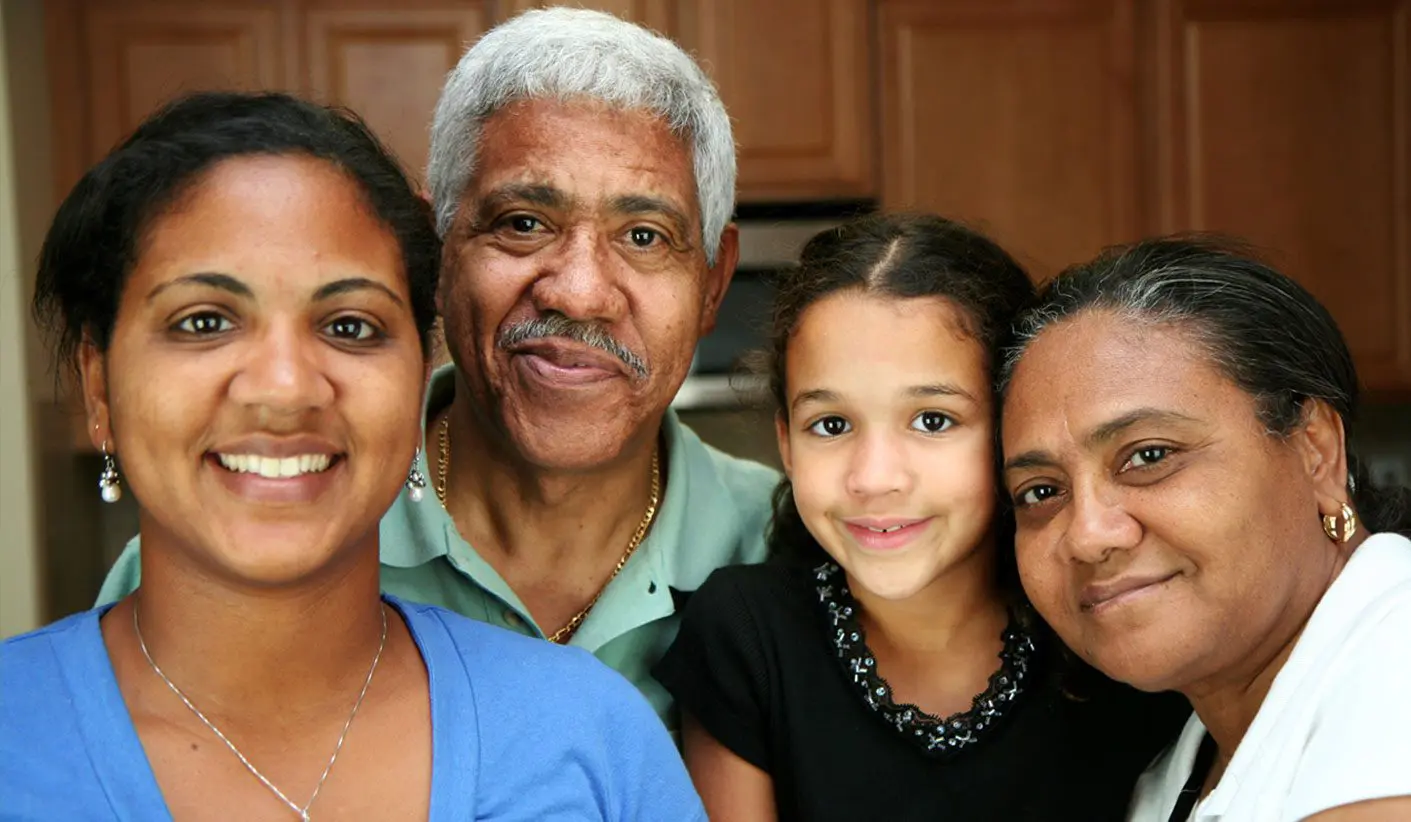 A family of four posing for the camera.