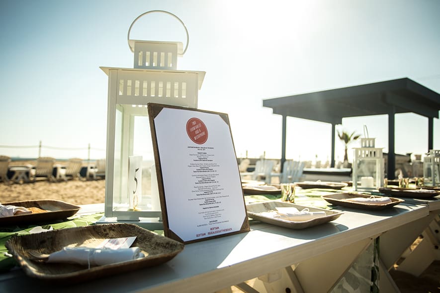 A menu is displayed on the table outside.