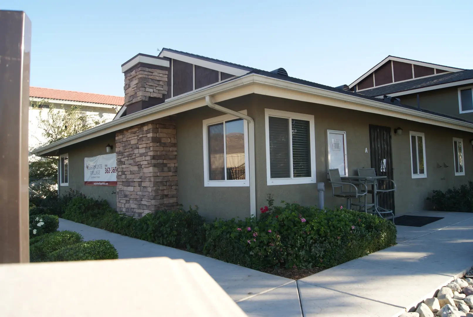 A house with a large porch and patio area.