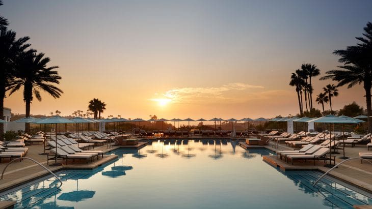 A pool with many boats in it at sunset