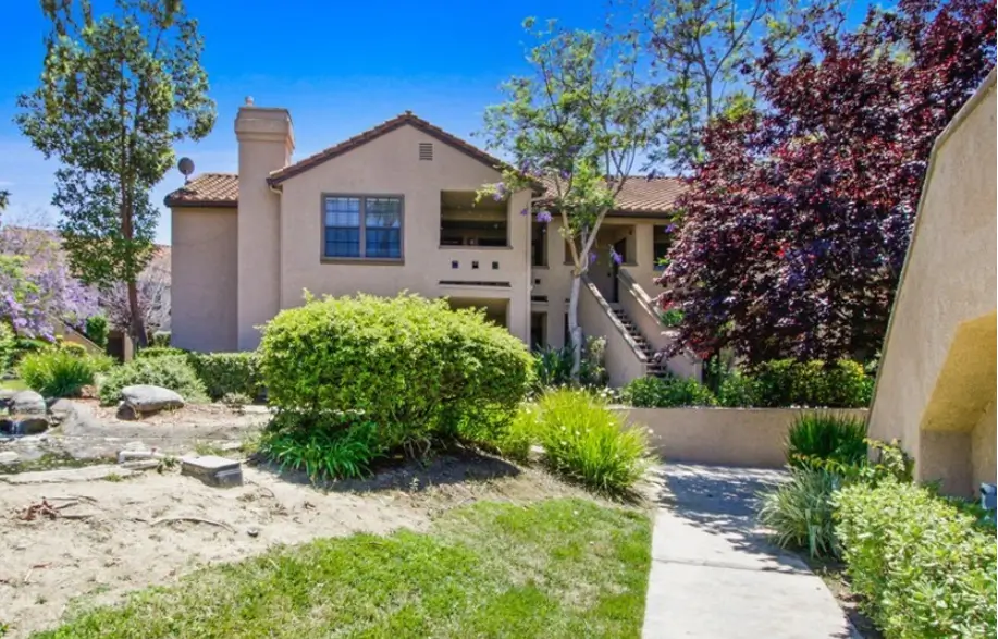 Mission beige exterior with clay tile roofs