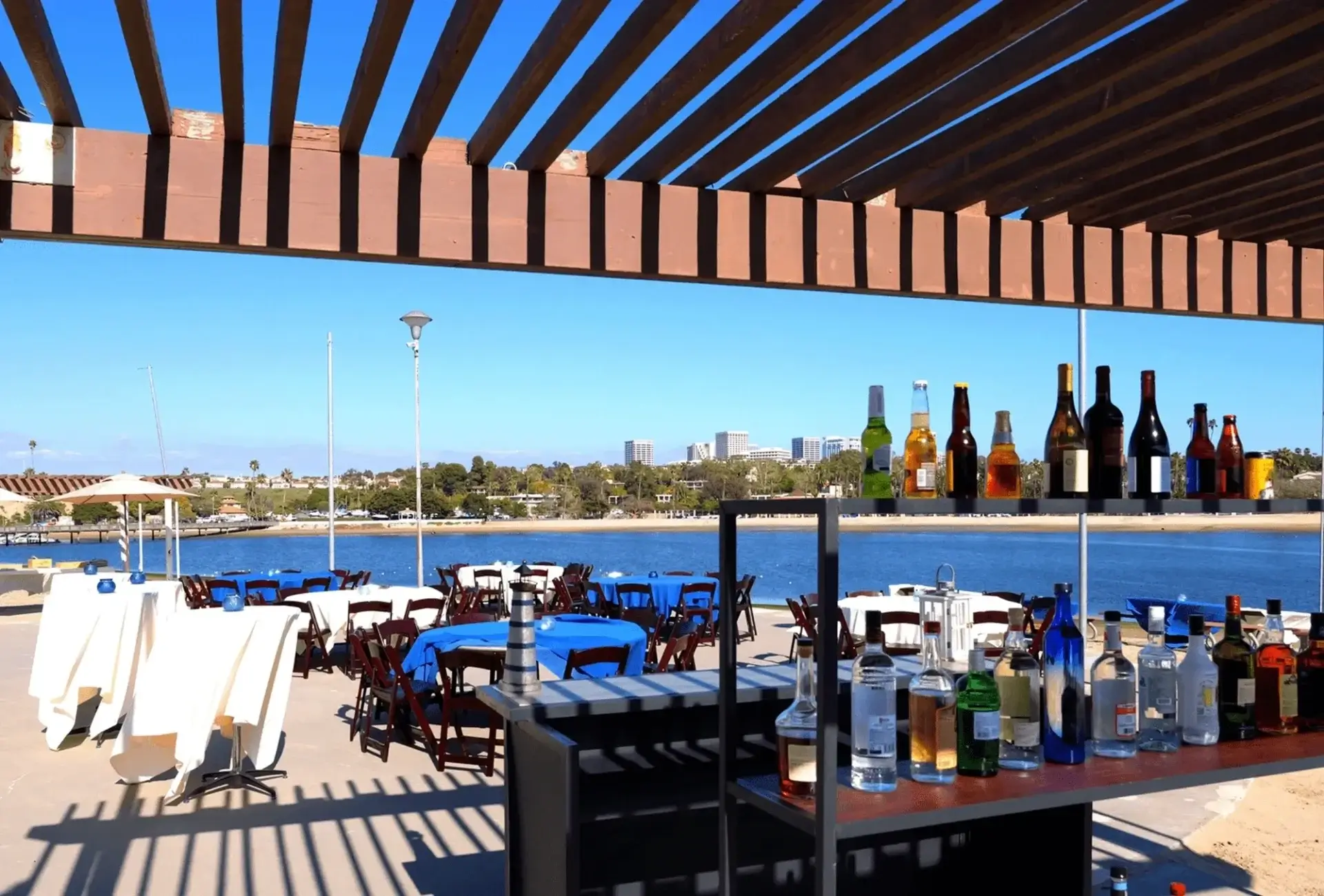 Outdoor bar and tables overlooking the water.